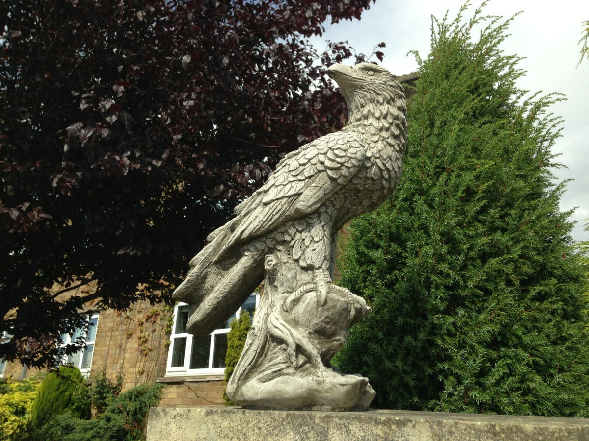 Garden Eagle Statue – Stone Perched Decor on pedestal, featuring detailed feathers and weatherproof limestone for outdoor garden use.