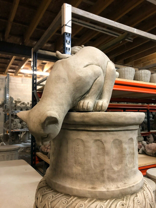 Garden Cat Statue in pouncing pose on a stone pedestal, crafted in limestone finish for outdoor garden decor.