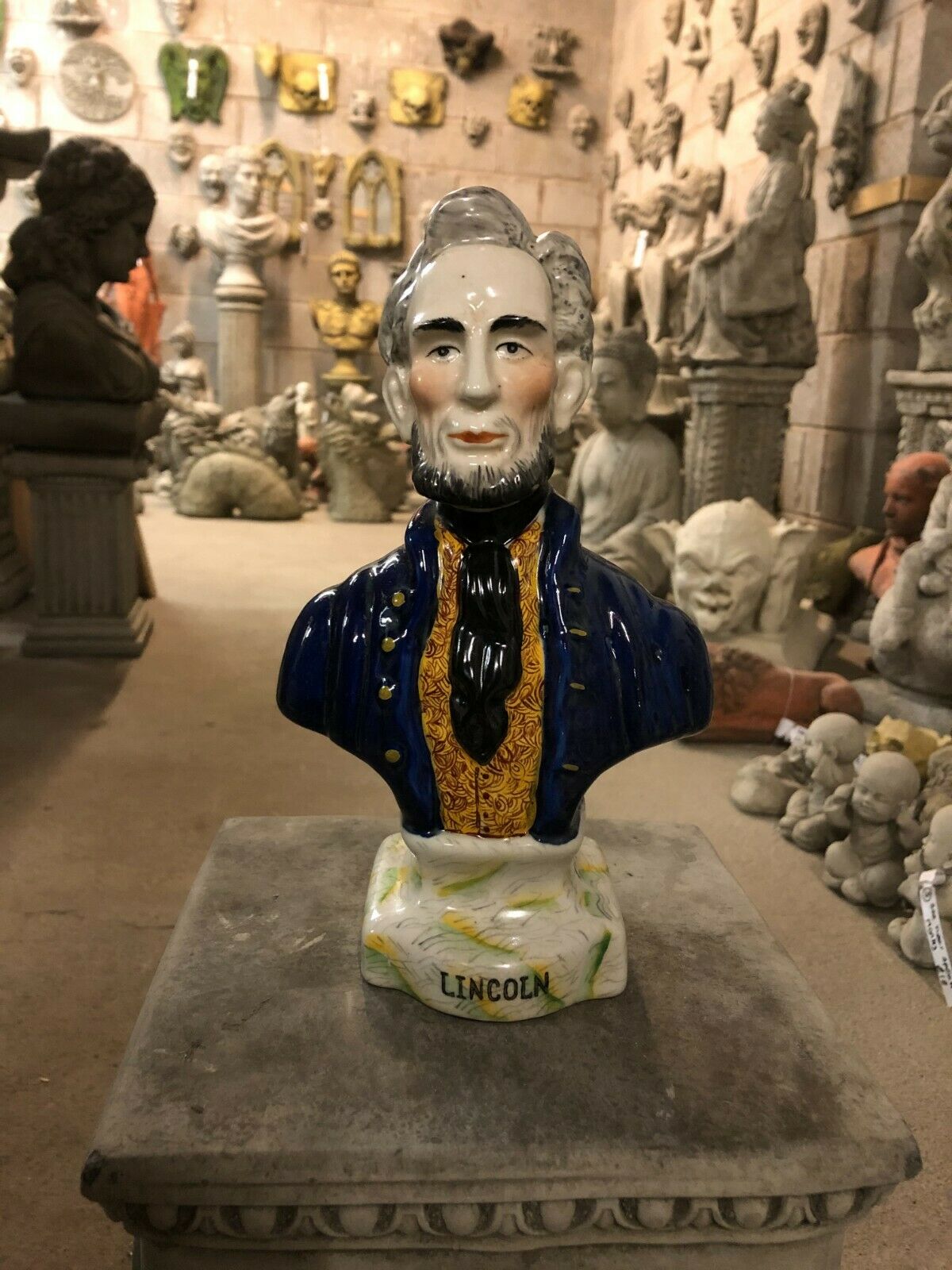 Ceramic Lincoln Ornament - Bust Sculpture featuring Abraham Lincoln in a blue and gold coat, ideal for home decor and collectible displays.