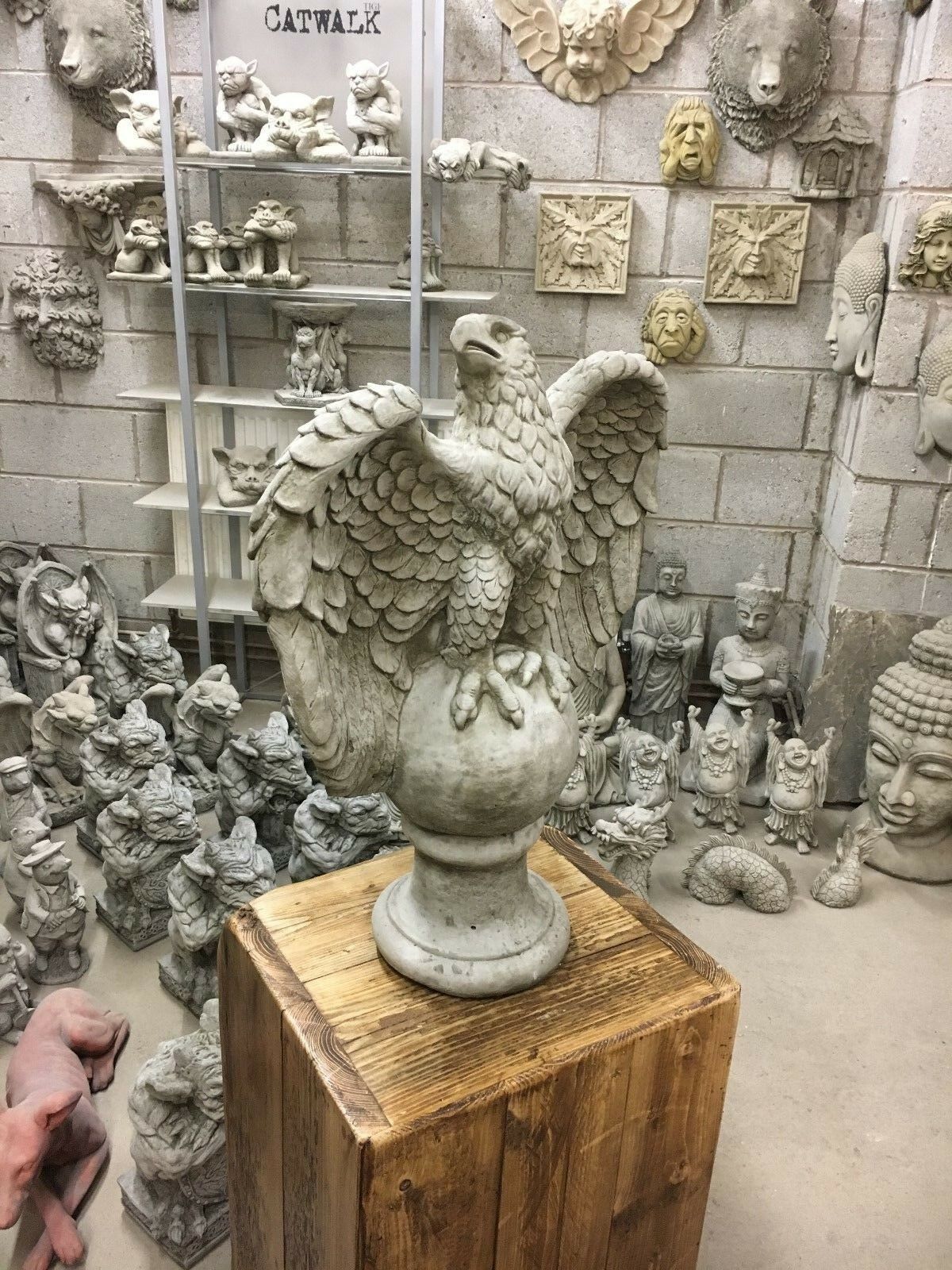 Majestic large stone eagle garden statue on pedestal, perfect for enhancing patios, lawns, or flowerbeds with timeless appeal.