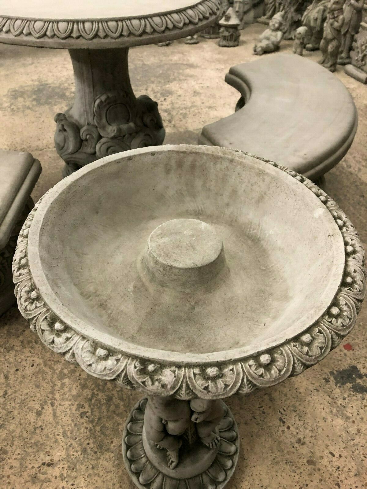 Top view of Cherub Garden Bird Bath - Stone Antique Finish featuring a wide, floral-rimmed basin. Durable for year-round outdoor use.