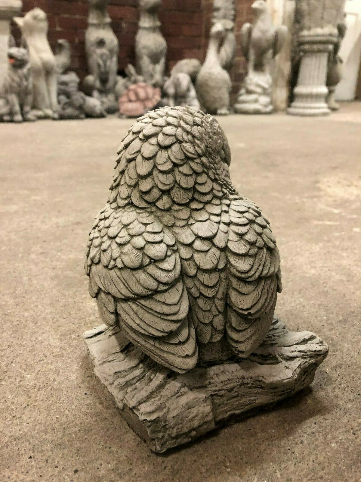 Back angle of Stone Owl on Log Garden Sculpture highlighting realistic feather patterns and weather-resistant limestone material.