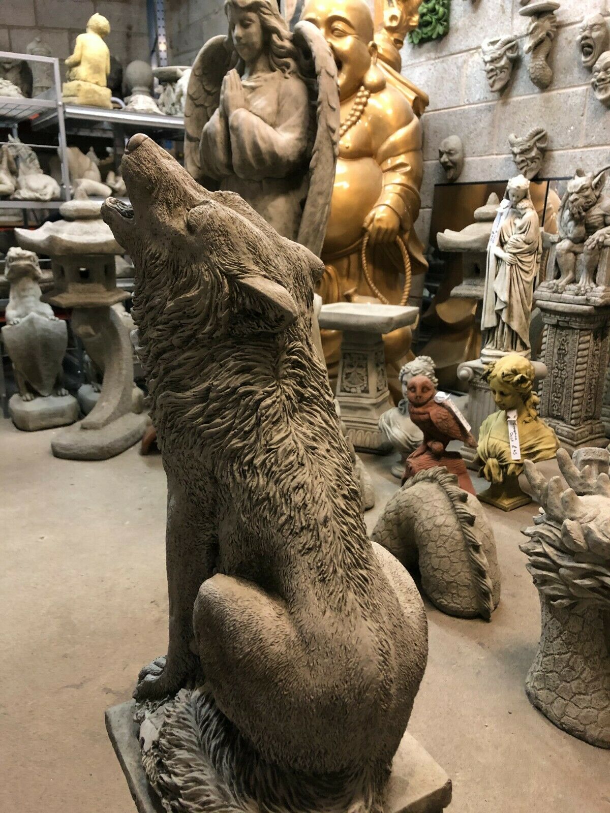 Rear side view of Howling Wolf Garden Statue with lifelike posture and antique stone texture, ideal for outdoor sculpture collections.