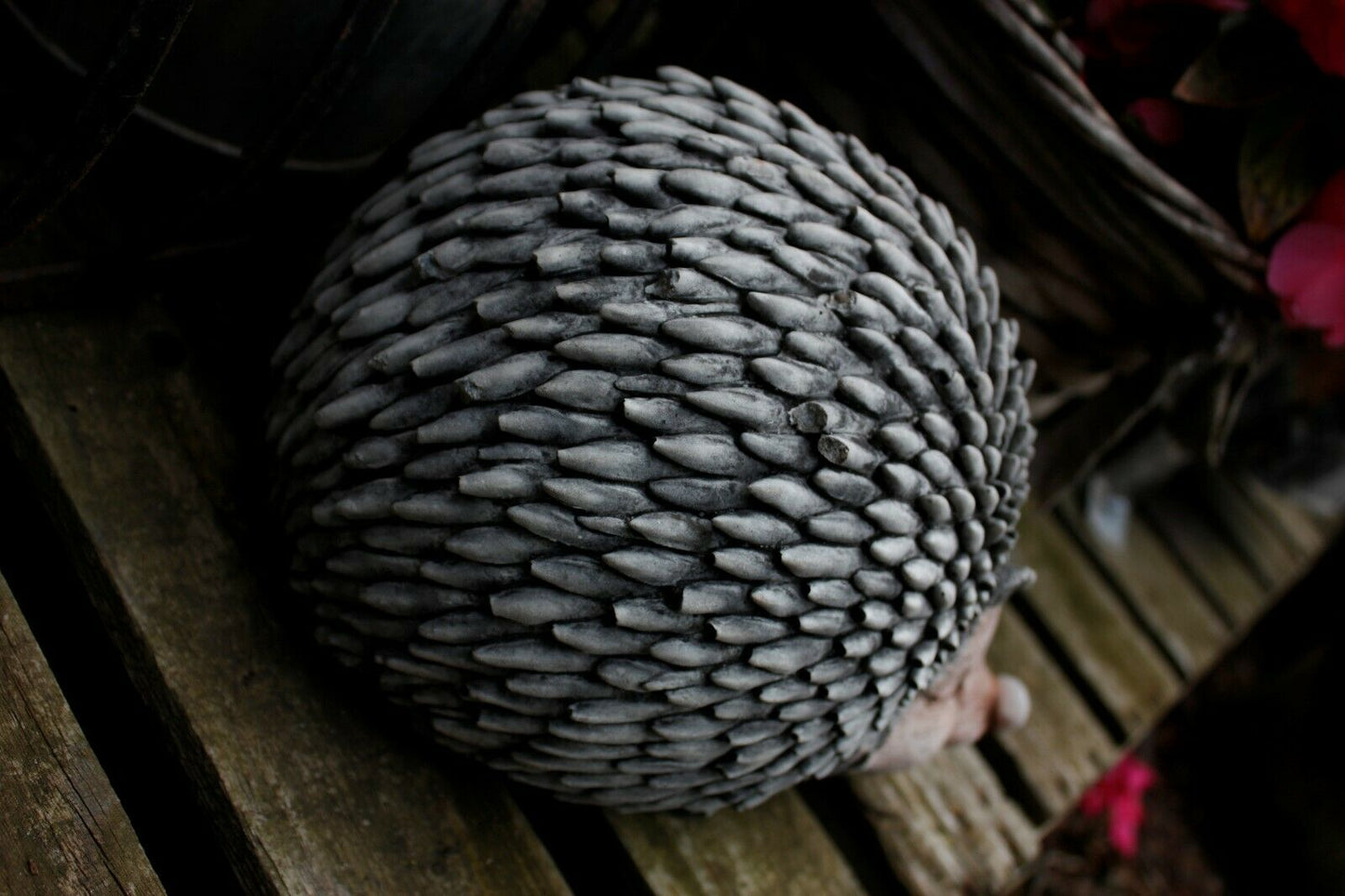 Top view of Stone Hedgehog Garden Ornament showing detailed limestone spines. Weather-resistant sculpture for patios and gardens.