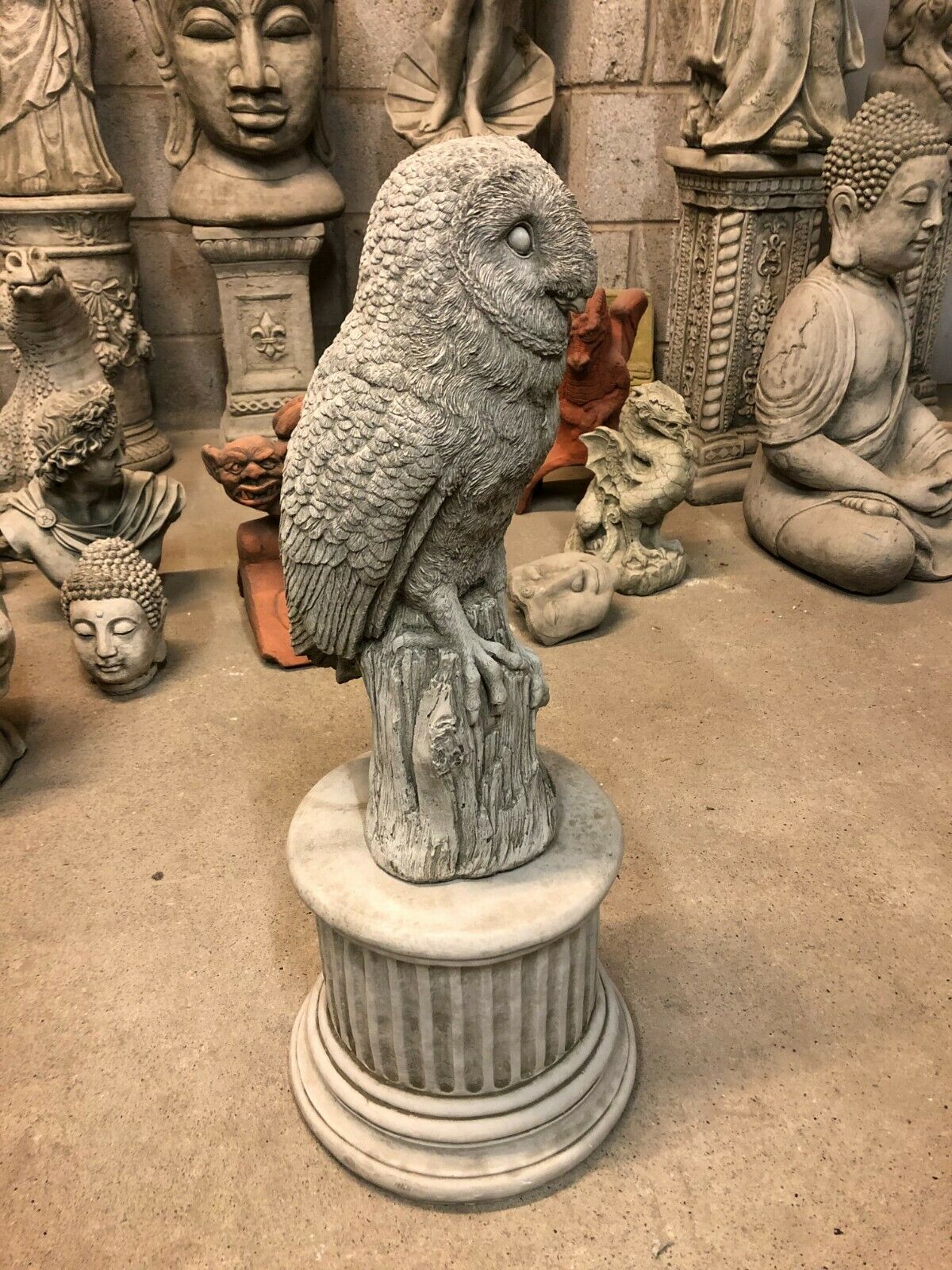 Angled view of Stone Owl Plinth Statue - Garden Decor | Solid Limestone highlighting antique grey finish and lifelike owl carving.