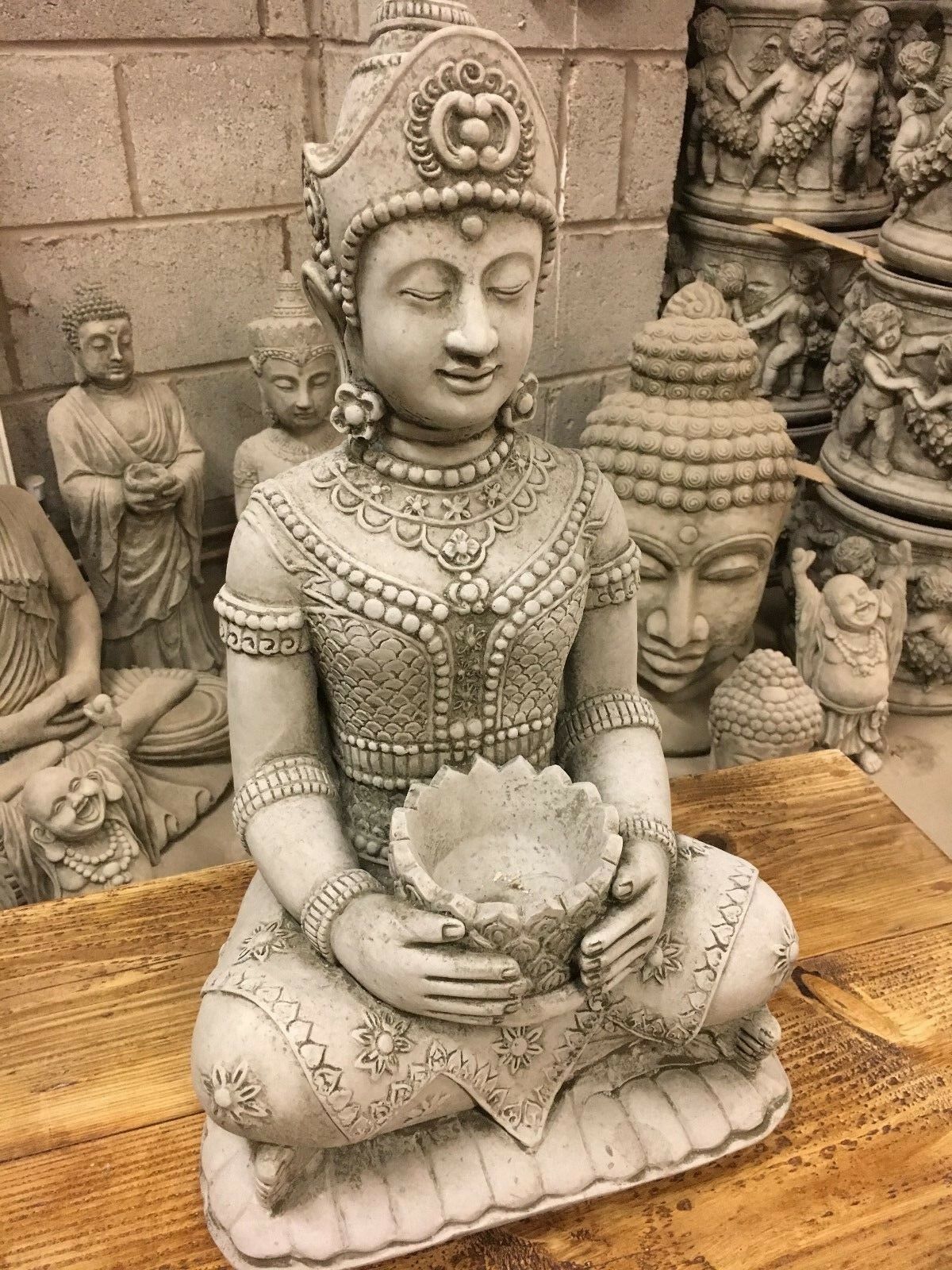 Front view of 55cm Stone Buddha Garden Statue with detailed robe and lotus bowl, symbolizing inner peace and tranquility for outdoor spaces.