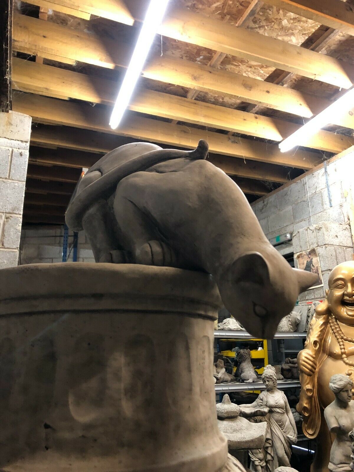 Stone Pouncing Cat Garden Statue with detailed features, ideal for lawn or patio display in home and garden settings.