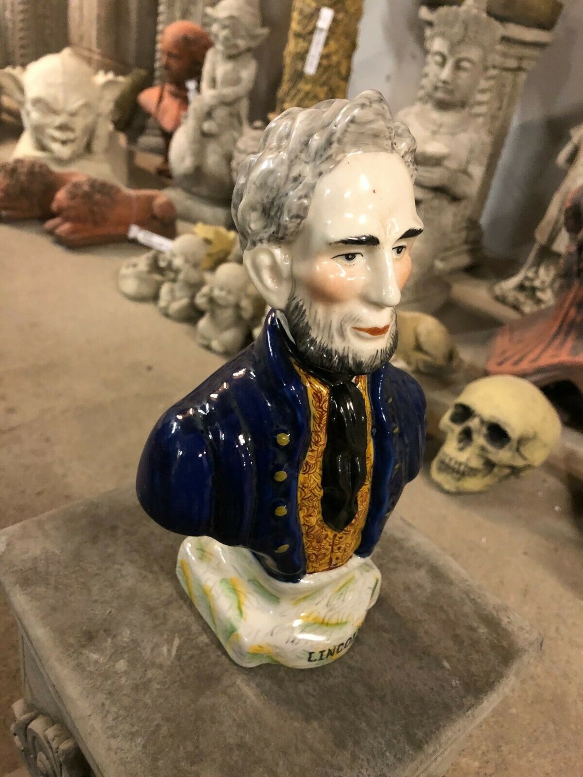 Side view of Ceramic Lincoln Bust Ornament with detailed facial features and hand-painted finish, perfect for artful home accents.