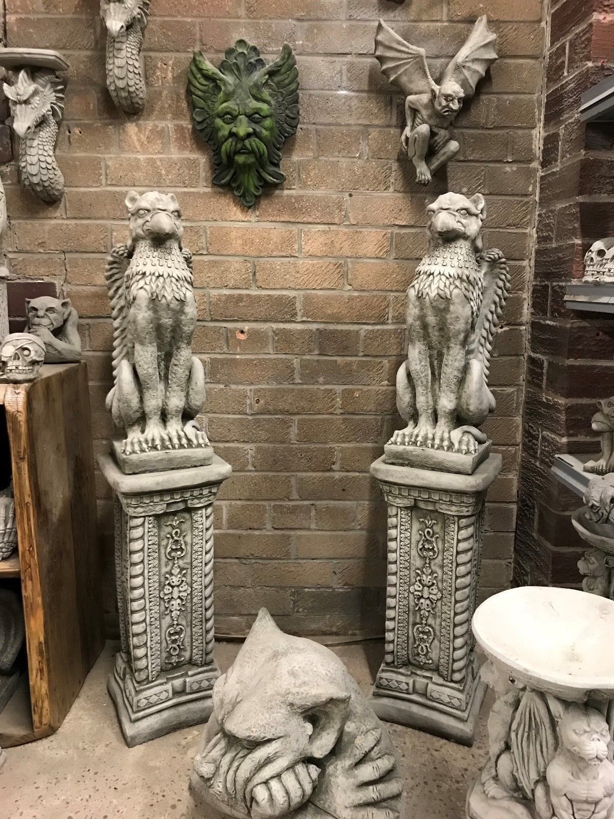 Pair of Stone Phoenix Garden Statues on ornate plinths, ideal as outdoor guardians. Heavy, weather-proof design for garden entrances or patios.