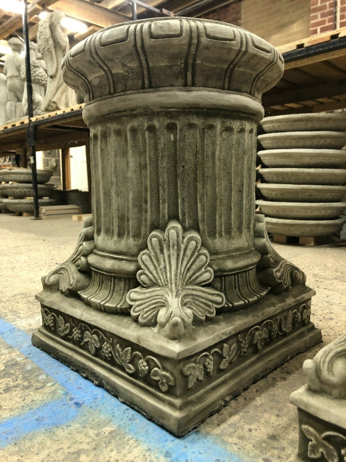 Close-up of a single Garden Stone Pedestal Plinth with intricate carvings and solid limestone build, designed for elegant outdoor garden sculpture display.