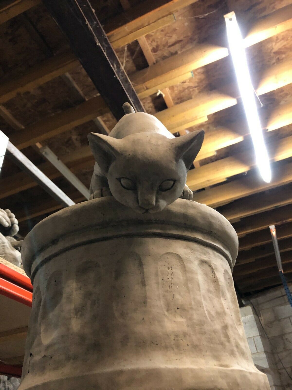 Front view of limestone Garden Cat Statue in pouncing stance, perfect for enhancing garden sculpture collections.