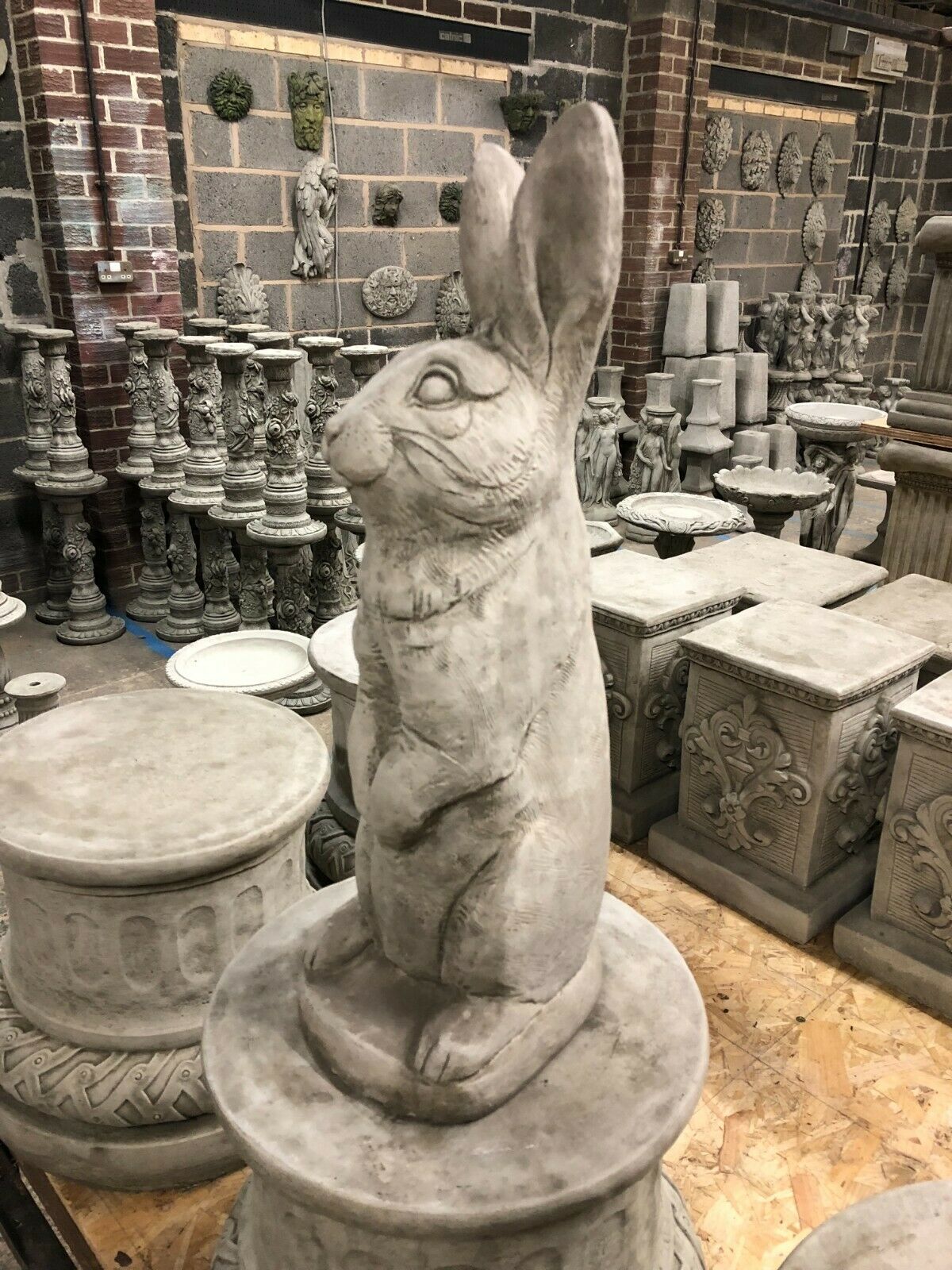 Solid Bunny Ornament - Stone Rabbit Garden figure shown in profile, made from heavy limestone for lasting outdoor decoration and charm.
