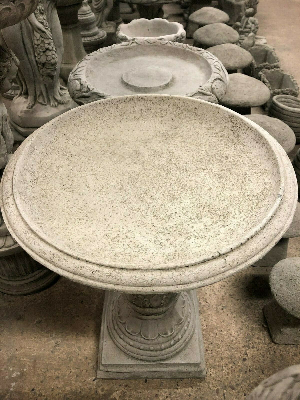 Stone Traditional Style Garden Bird Bath with wide shallow bowl and detailed edging. Durable and elegant for home garden decoration.