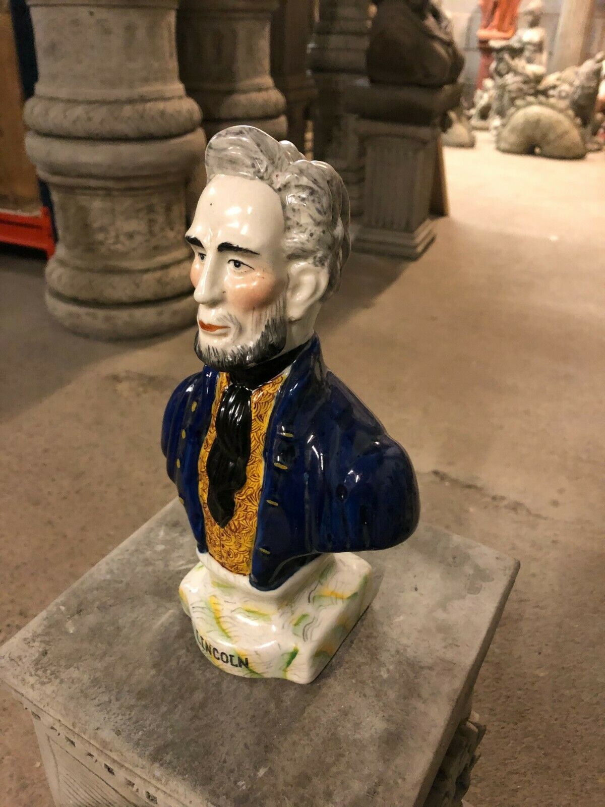 Angled view of Ceramic Lincoln Ornament - Bust Sculpture showcasing intricate craftsmanship and vibrant colors for decorative use.