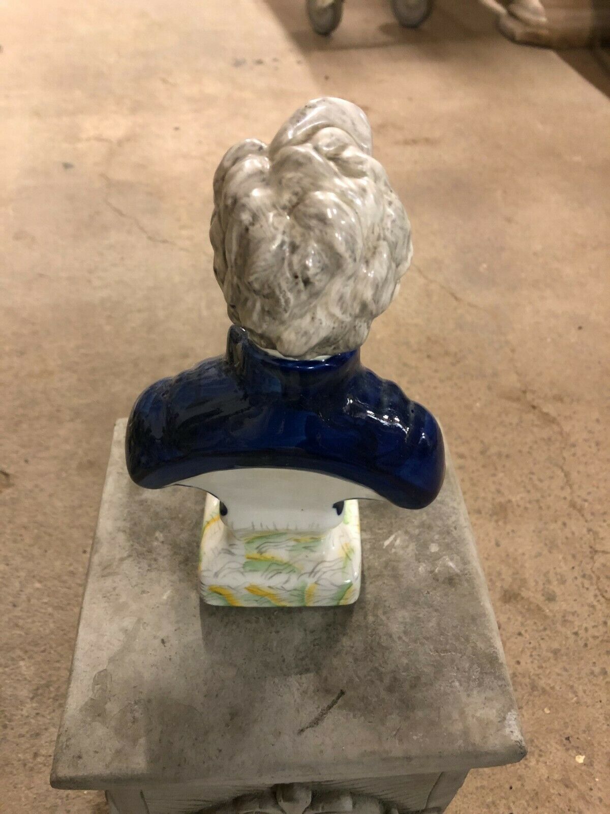 Rear view of Ceramic Lincoln Bust Ornament highlighting textured gray hair and painted base, a unique home and garden figurine.