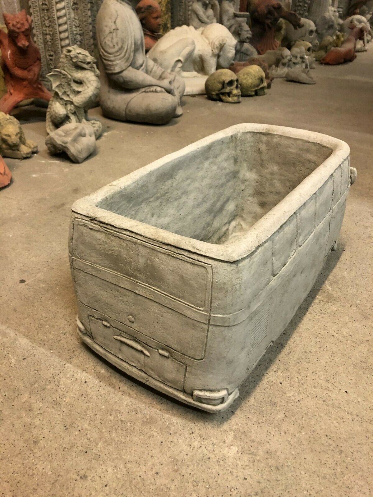 Rear view of Stone VW Camper Van Planter emphasizing its solid stone construction and intricate back panel design.