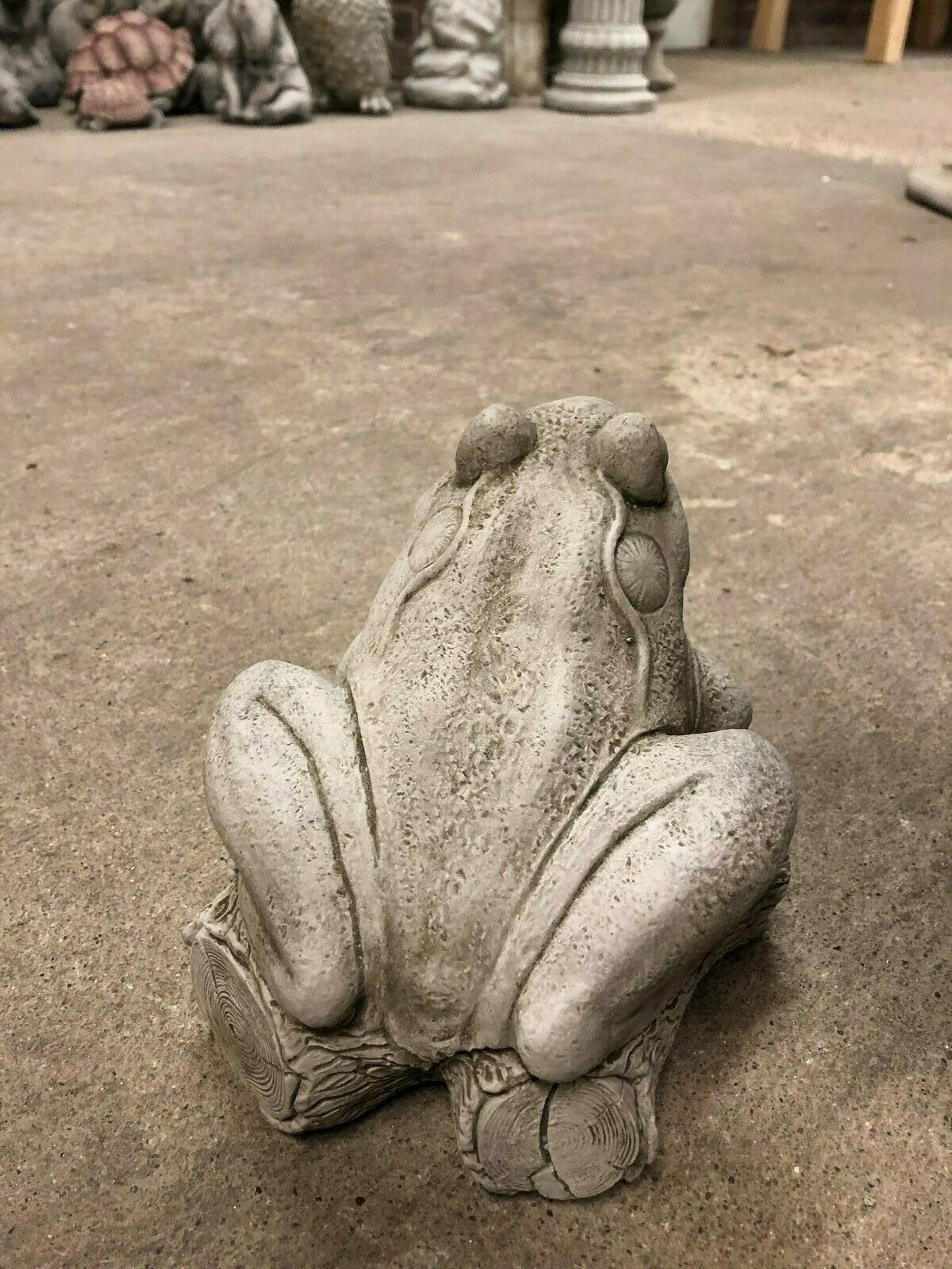 Rear angle of stone frog on log garden ornament, highlighting its solid build and rustic finish for long-lasting garden decoration.