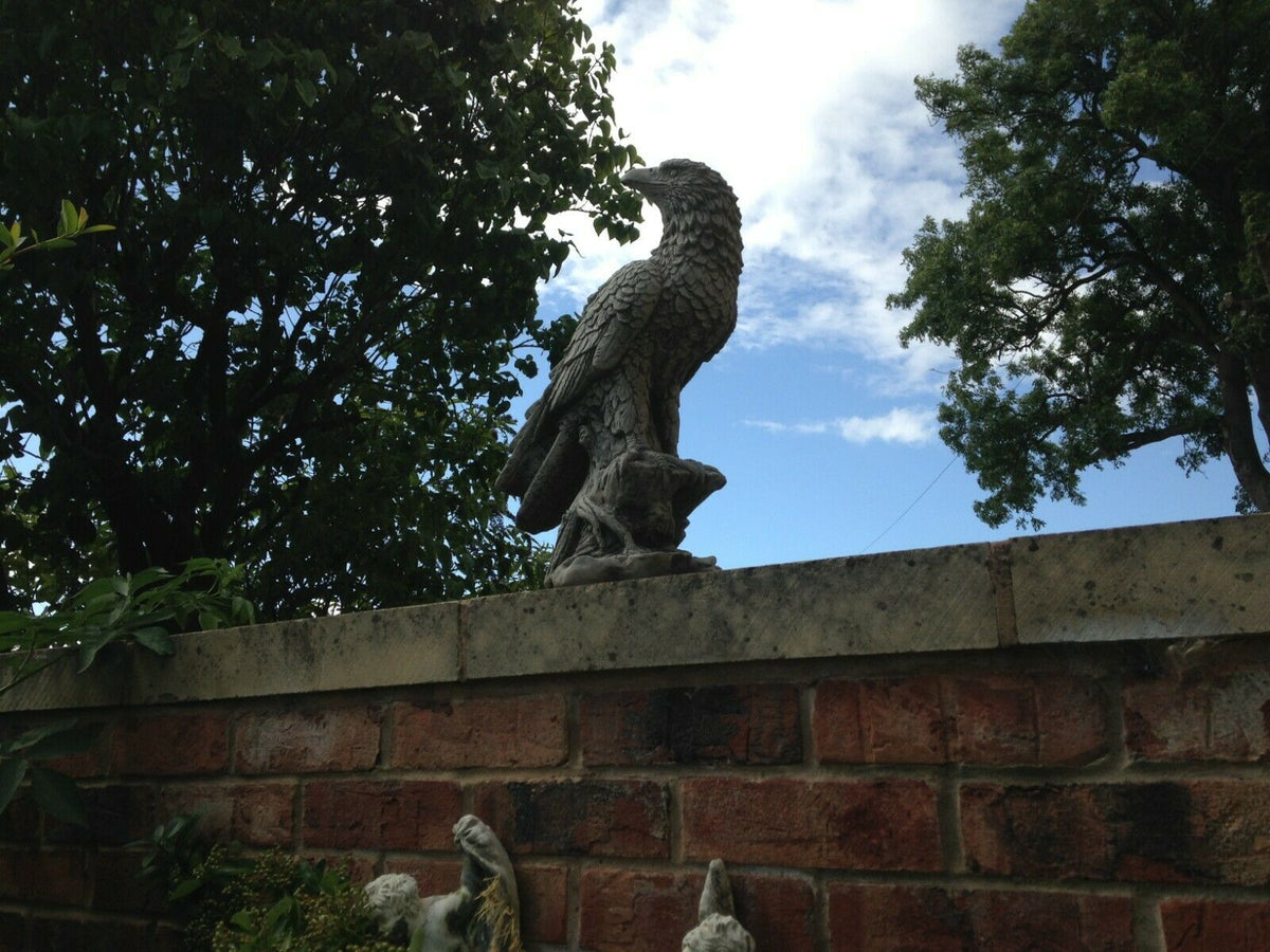 Stone Eagle Garden Ornament on brick wall, designed for outdoor display with realistic texture and weather-resistant limestone material.