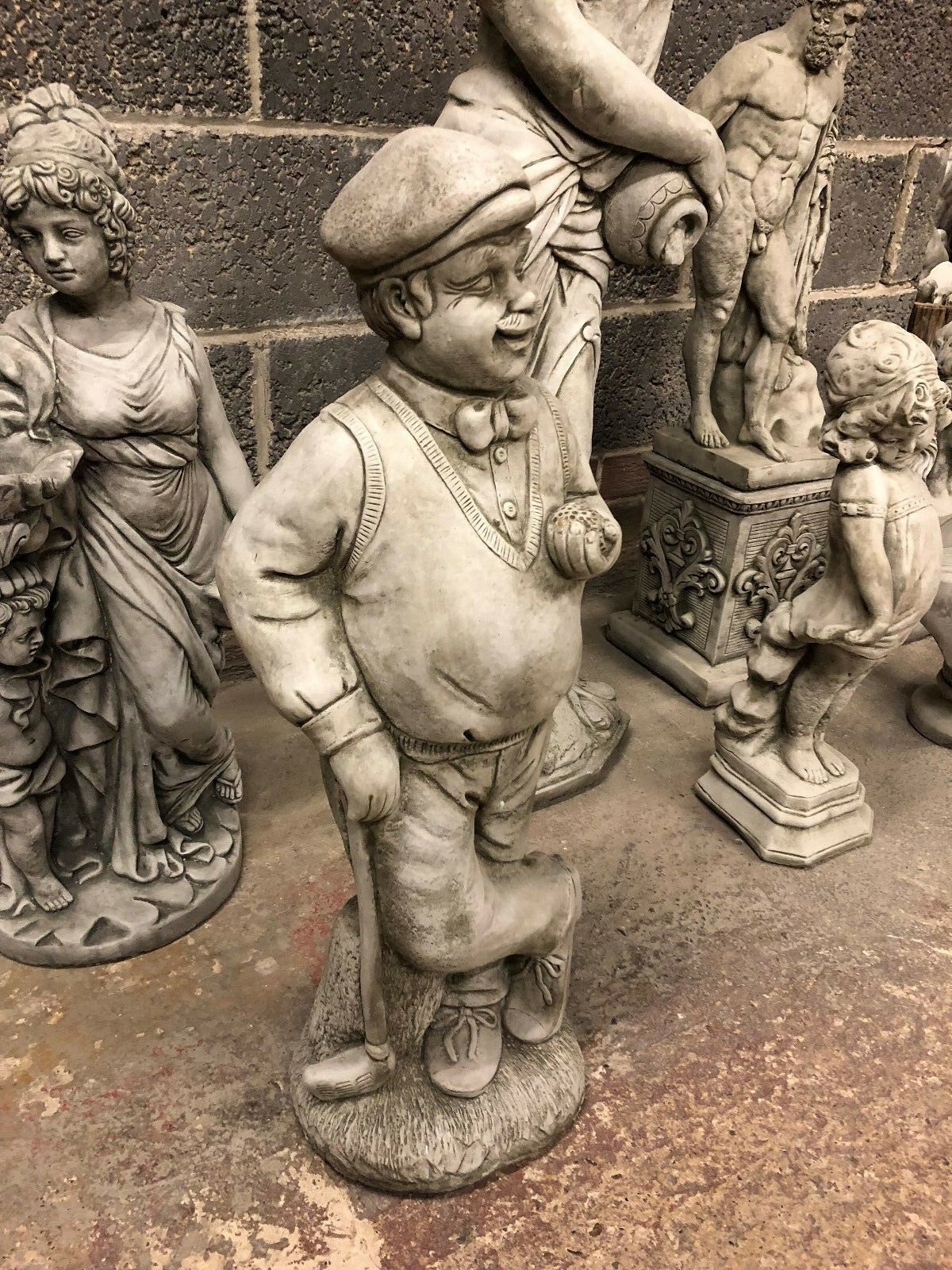 Weather-resistant 76cm Stone Golfer Garden Statue with detailed craftsmanship, perfect for enhancing patios, lawns, or flowerbeds with classic charm.
