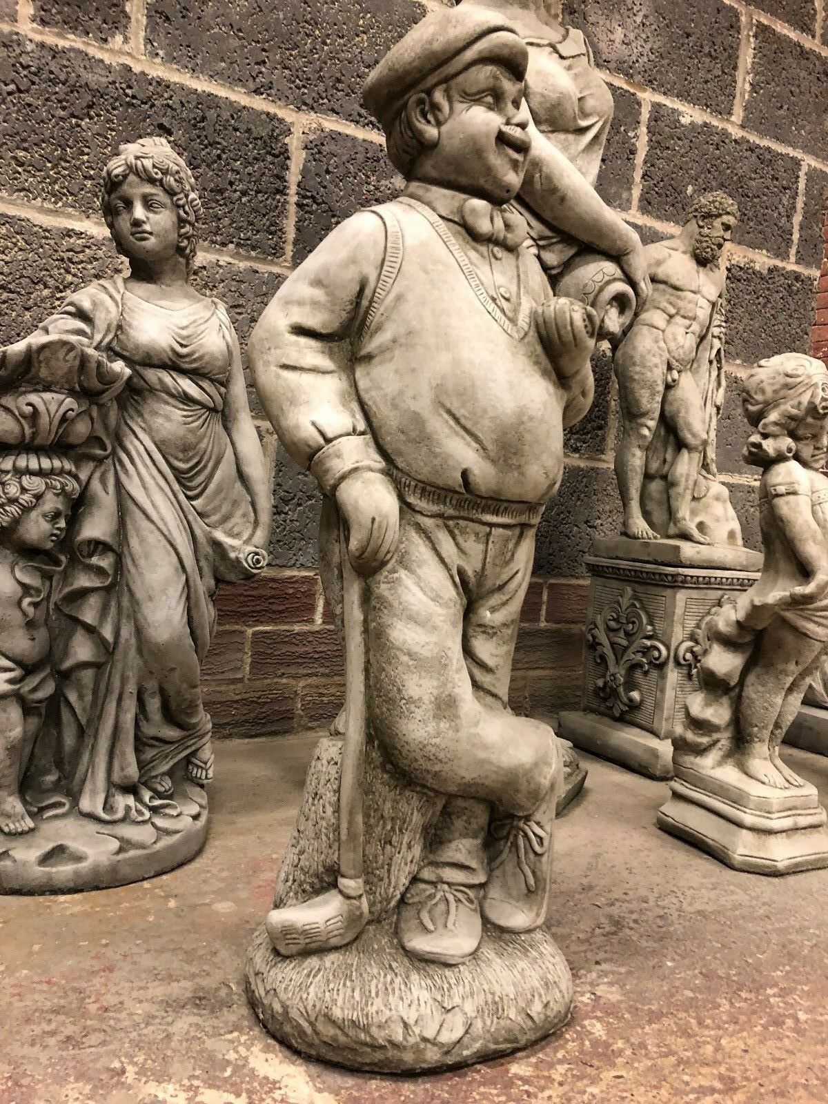 Elegant Stone Golfer Statue for Garden, showcasing a relaxed pose and intricate details. A timeless lawn ornament for home and garden decoration.
