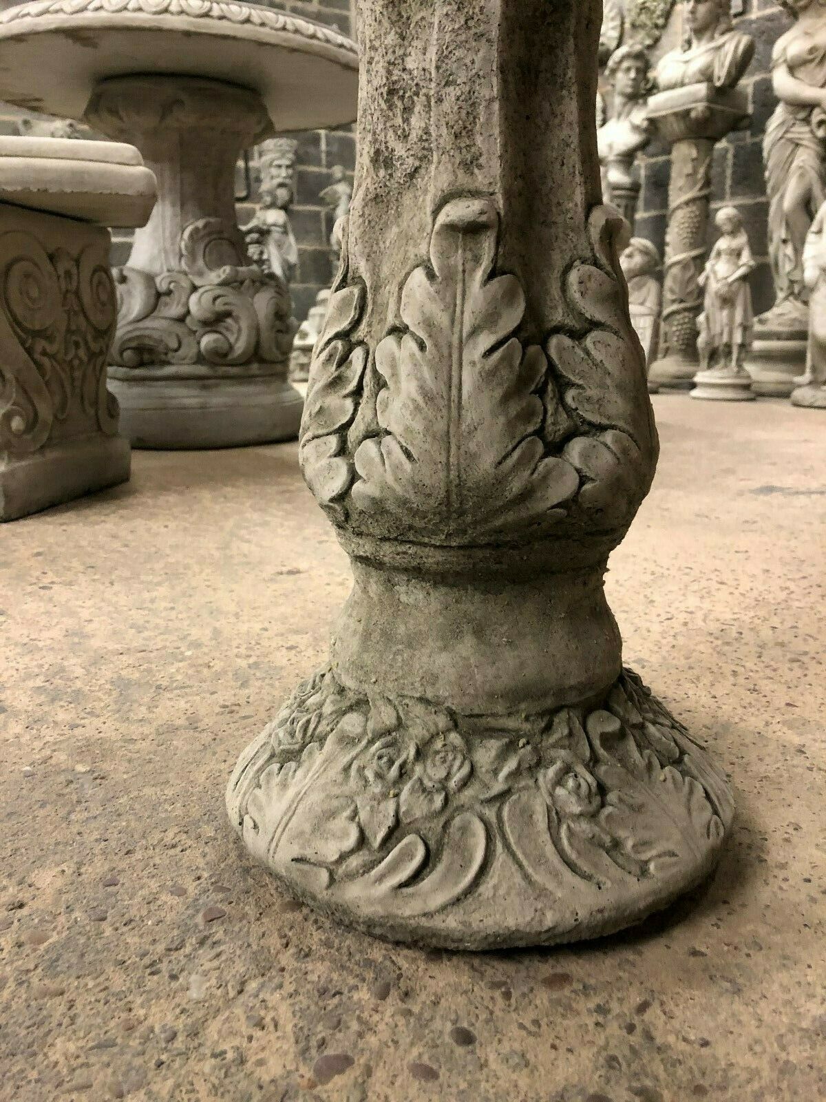 Close-up of Stone Leaf Design Bird Bath base showing intricate leaf detailing, crafted from solid limestone for durability.