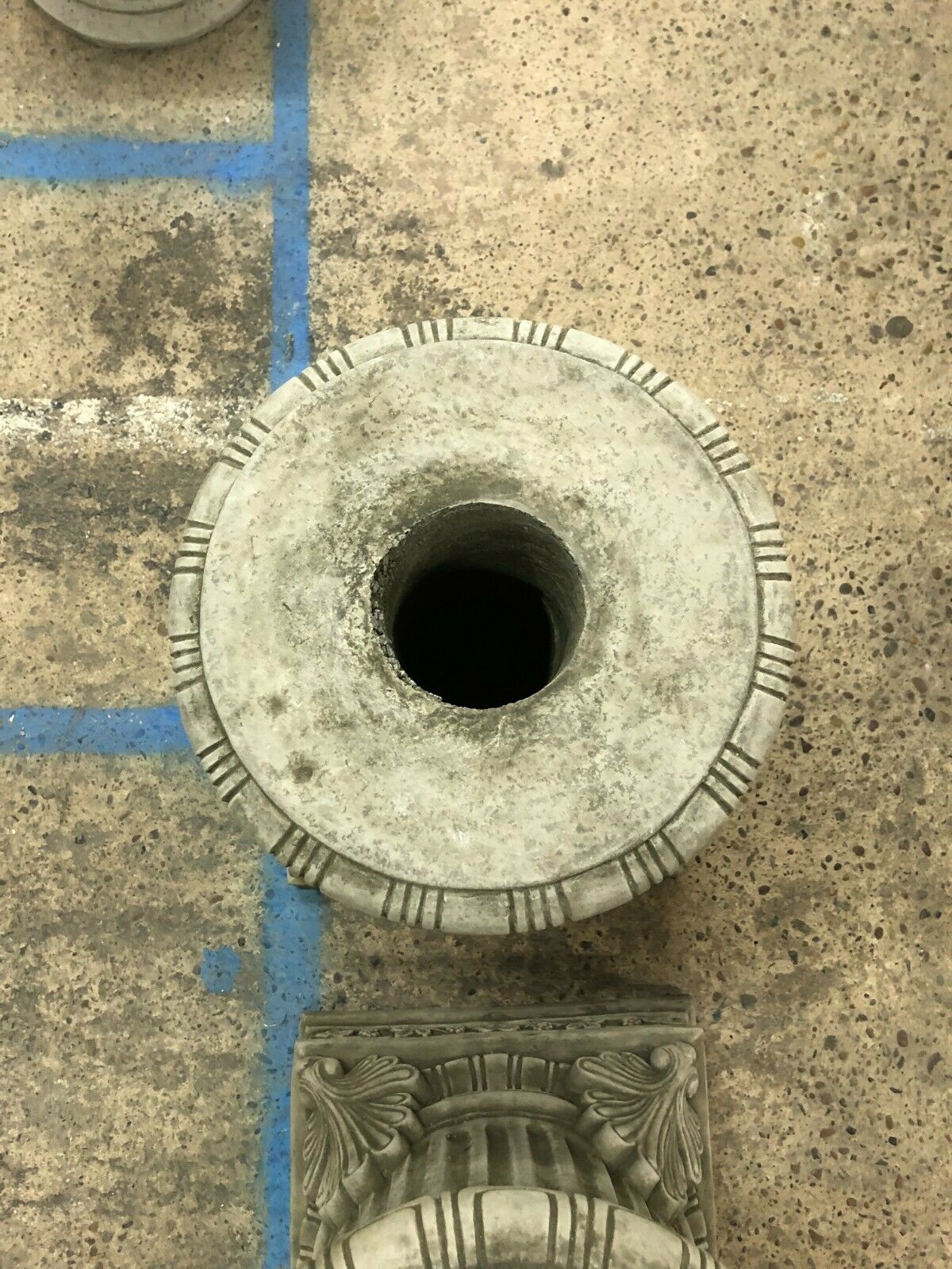 Overhead view of a Garden Stone Pedestal Plinth’s circular top with central hole, ideal for supporting columns, urns, or garden sculptures.