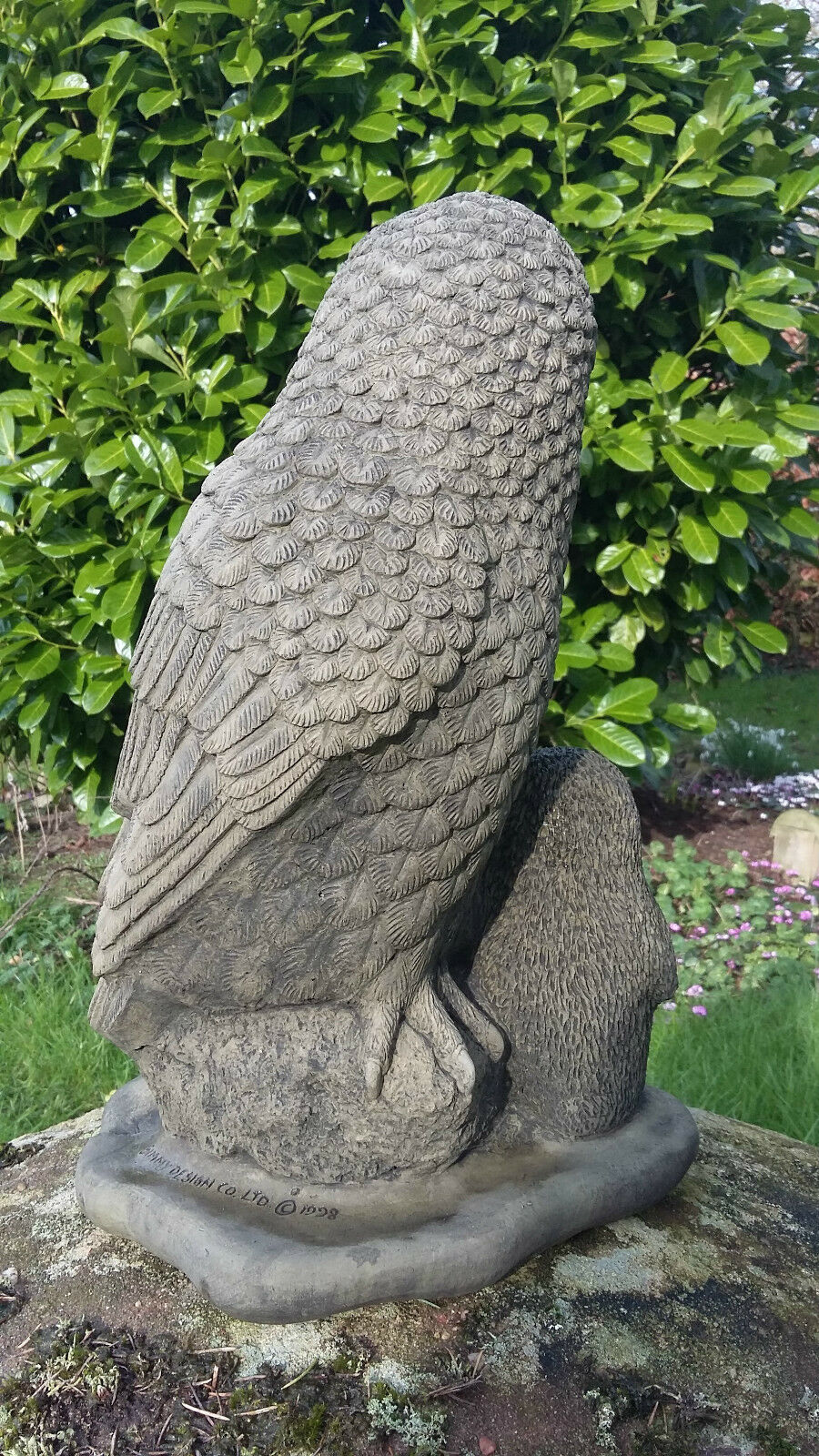 Rear view of the Stone Owl Garden Statue showing intricate feather detailing, crafted from durable limestone for long-lasting garden ornament use.