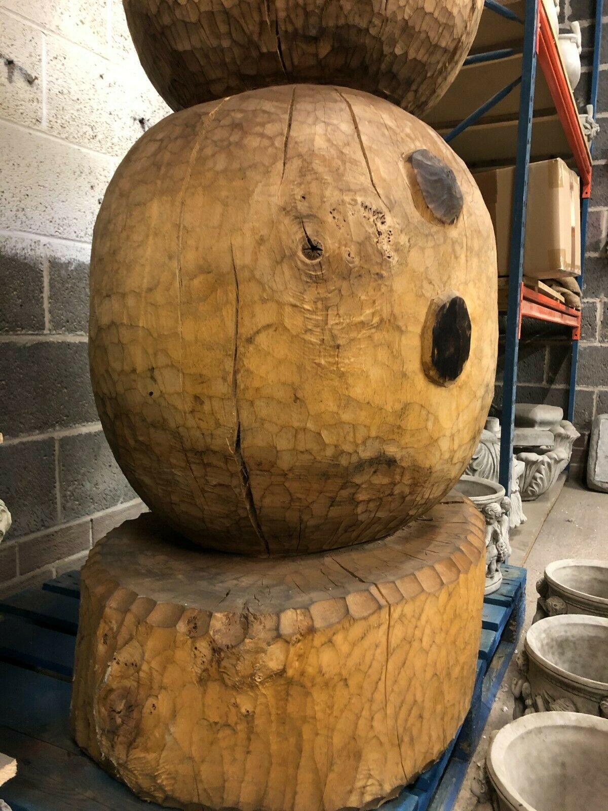 Base of the Giant Wooden Olaf Statue showing solid craftsmanship and sturdy support for outdoor garden placement.
