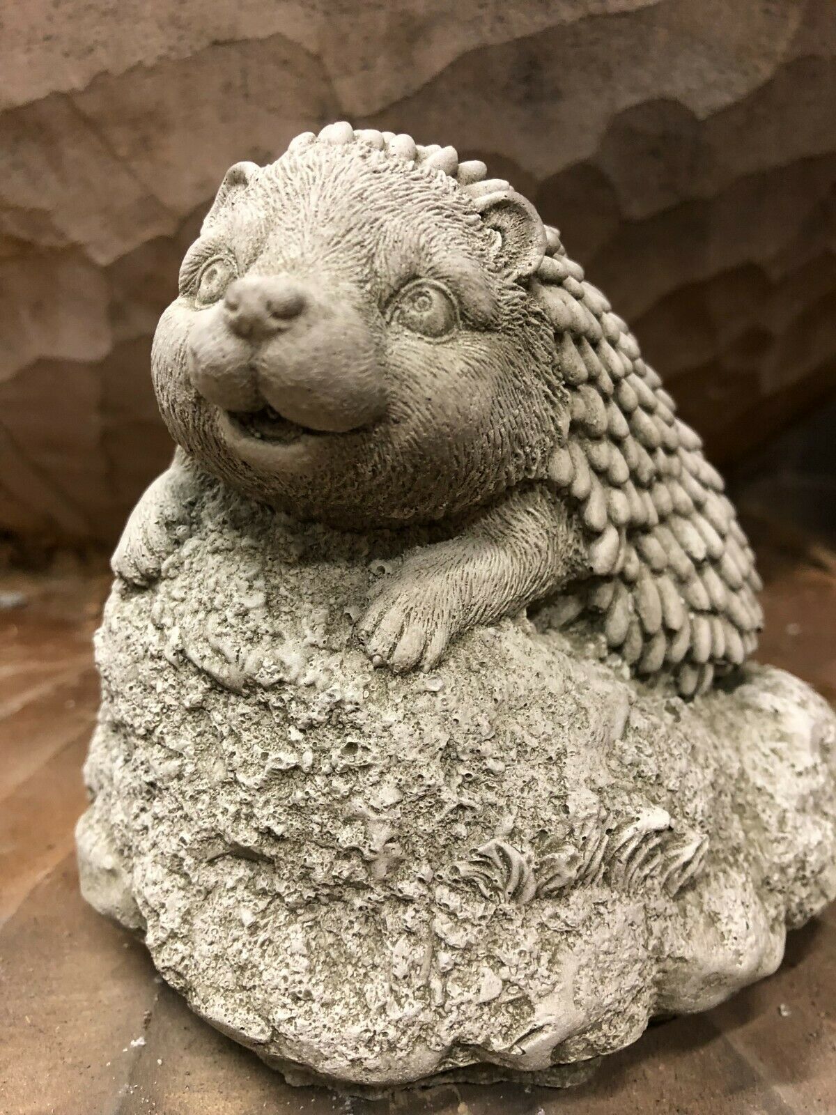 Close-up of Stone Baby Hedgehog Ornament showing detailed facial features and textured spines, perfect for outdoor garden decoration.