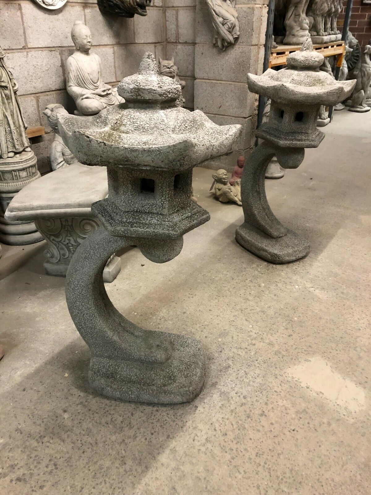 Pair of durable stone lanterns in pagoda style with antique grey finish, ideal for enhancing oriental-themed garden décor.