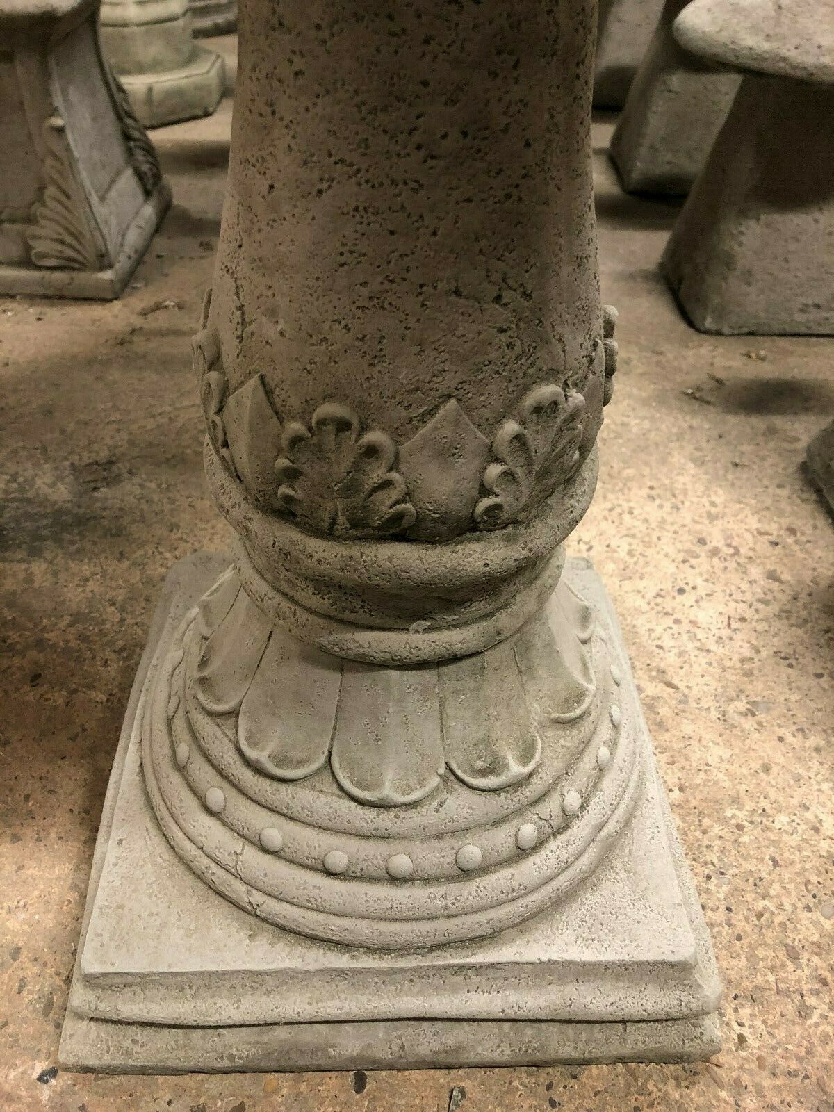 Detailed base of Stone Traditional Style Garden Bird Bath with antique finish, showcasing classic ornamental carvings and solid stone craftsmanship.