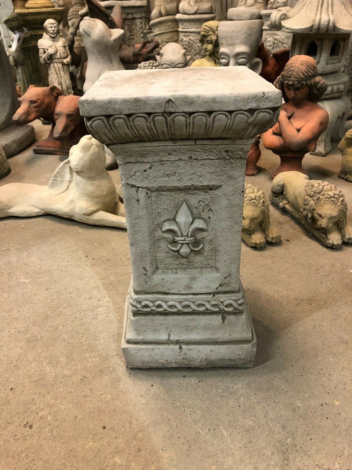 Antique grey Stone Fleur De Lis Pedestal with intricate rope and floral motifs, designed for garden ornament display. Durable and weatherproof.
