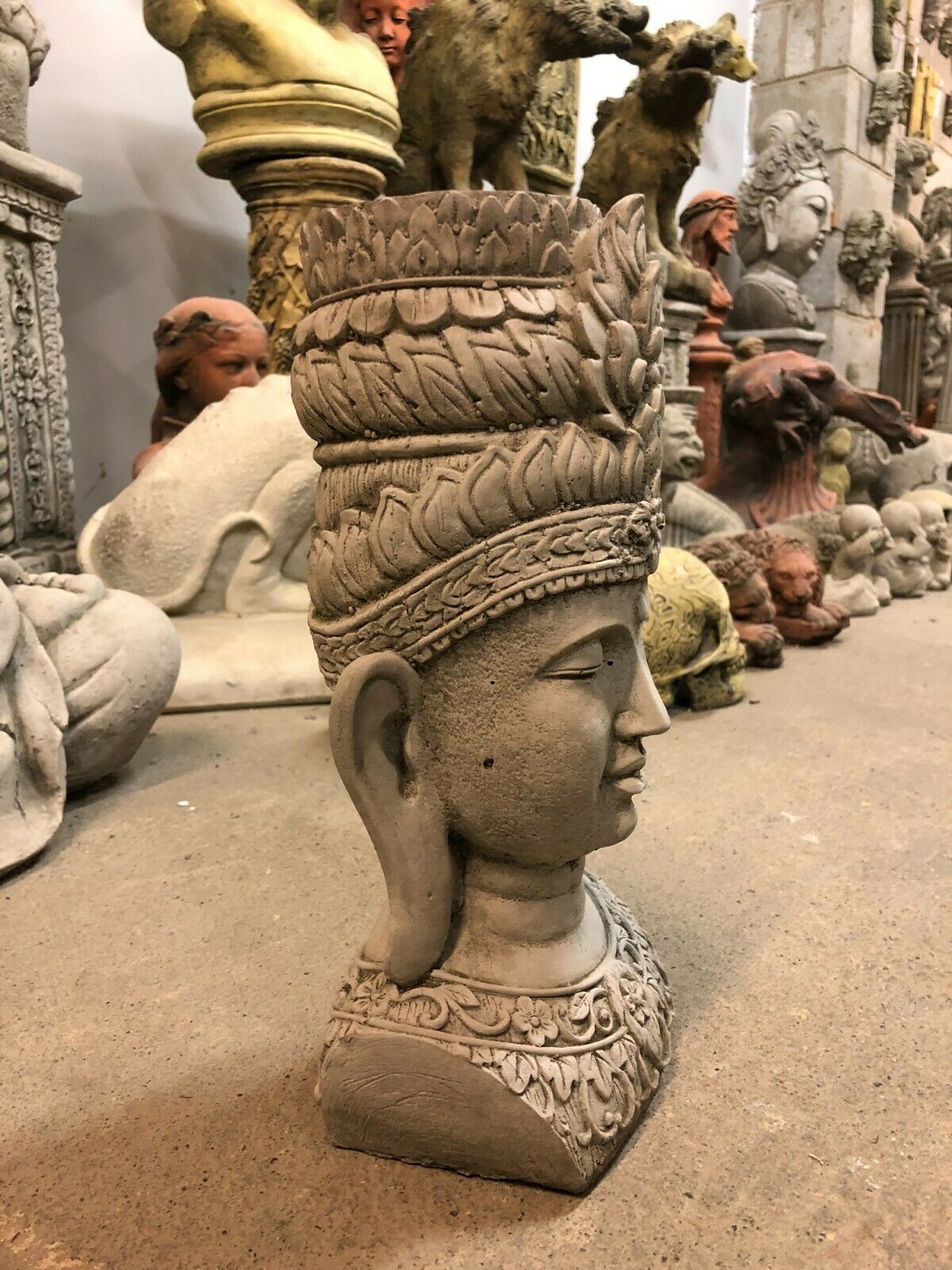 Side profile of Tranquil Stone Buddha Bust - Garden Ornament | Weatherproof Finish, showcasing detailed craftsmanship and serene expression.