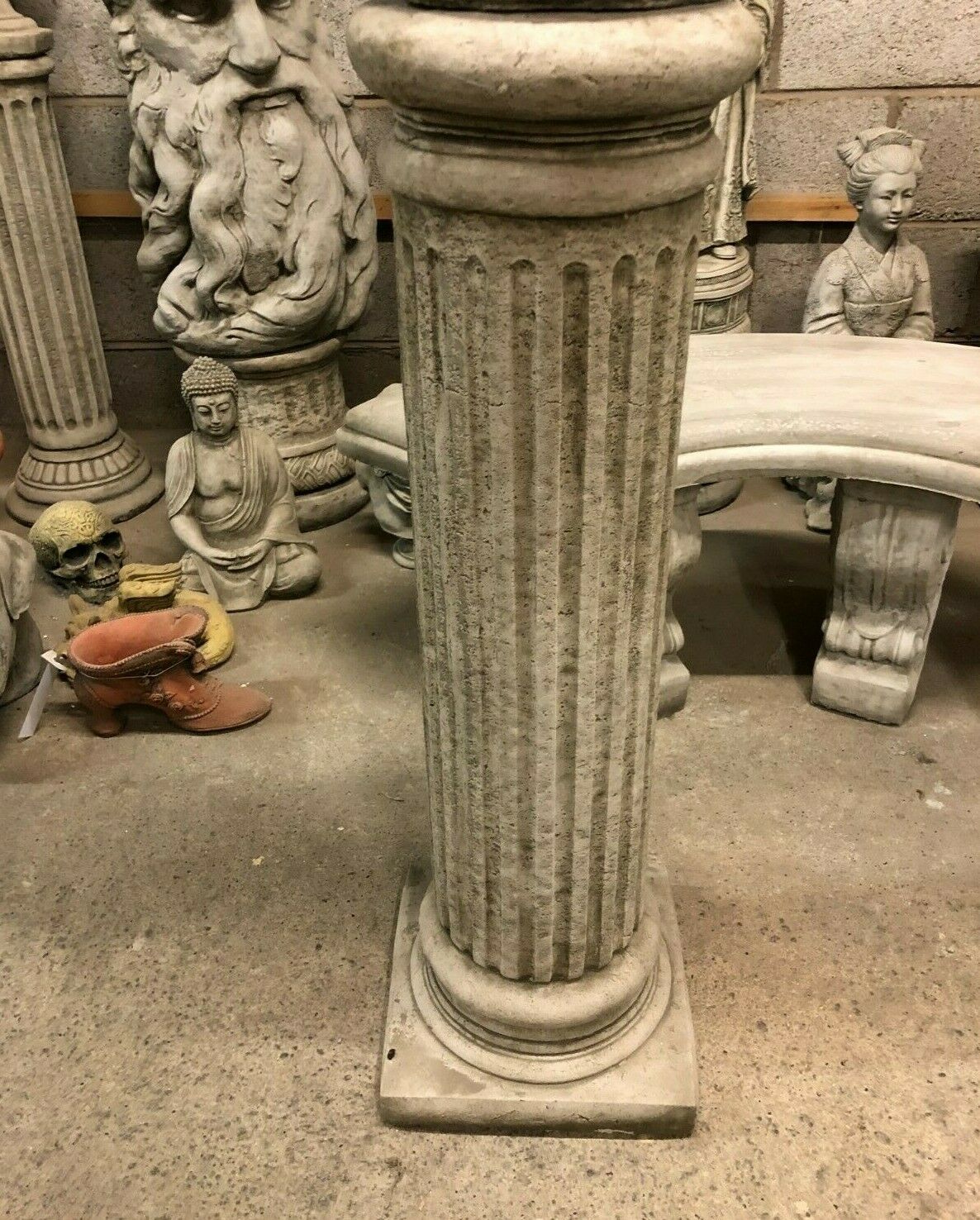 Close-up of a single Roman Garden Column Plinth in weather-resistant limestone, showcasing detailed fluted design for home or garden use.