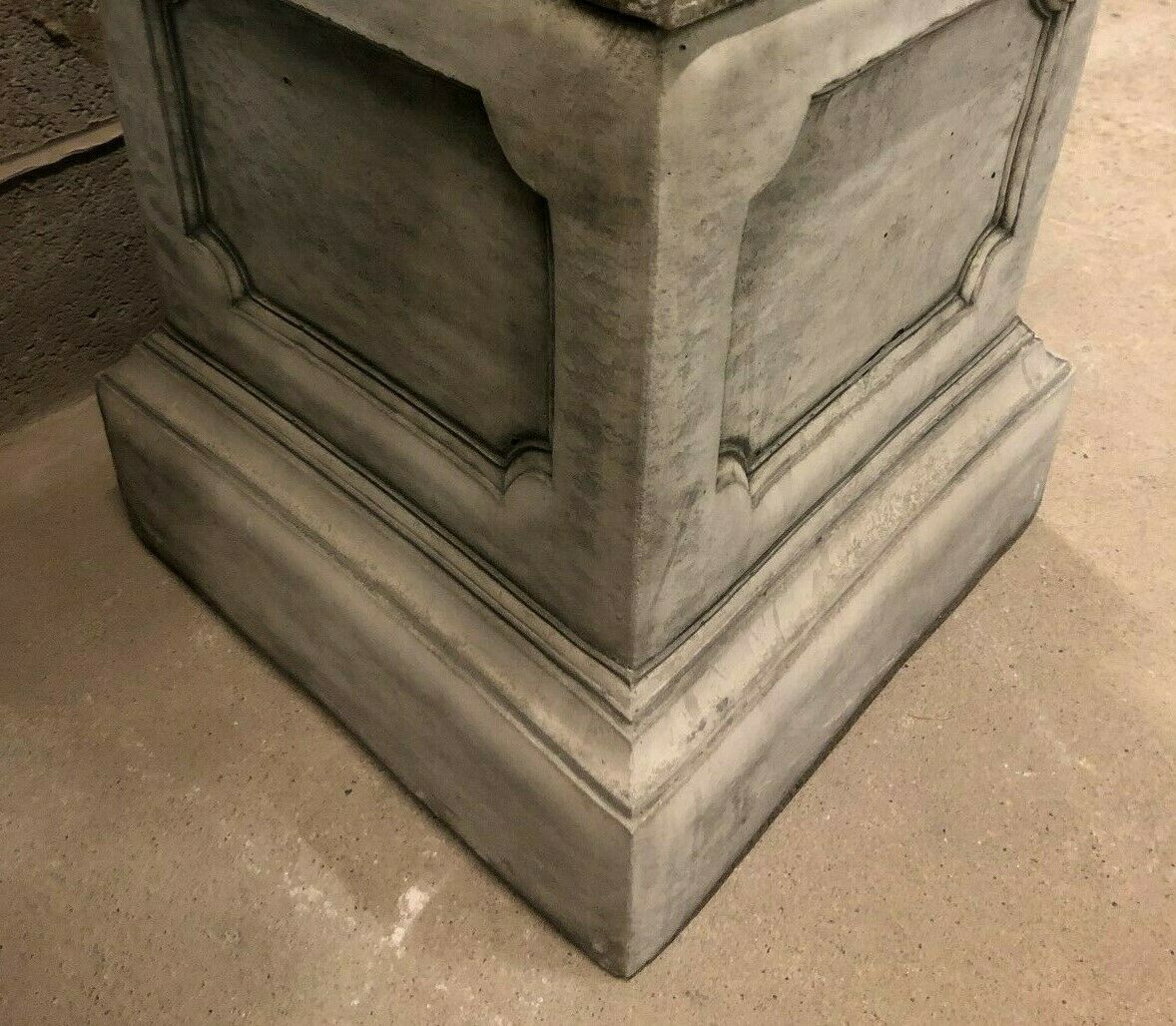 Close-up of square limestone plinth base for lion garden statues, showcasing durable craftsmanship and classic panel detailing.