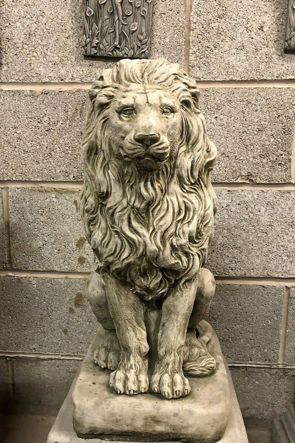 Front view of a single stone lion statue with intricate mane detail, designed for outdoor garden or porch decoration.