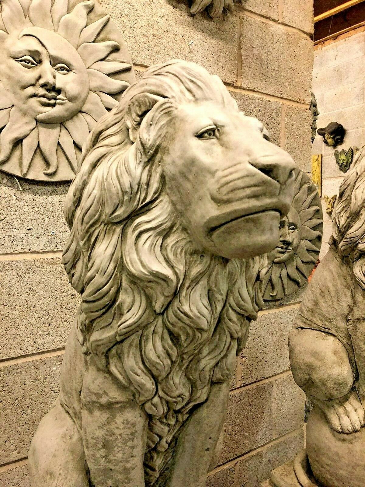 Close-up of lion statue's face and mane texture, showcasing the fine limestone detail for high-end garden sculpture appeal.