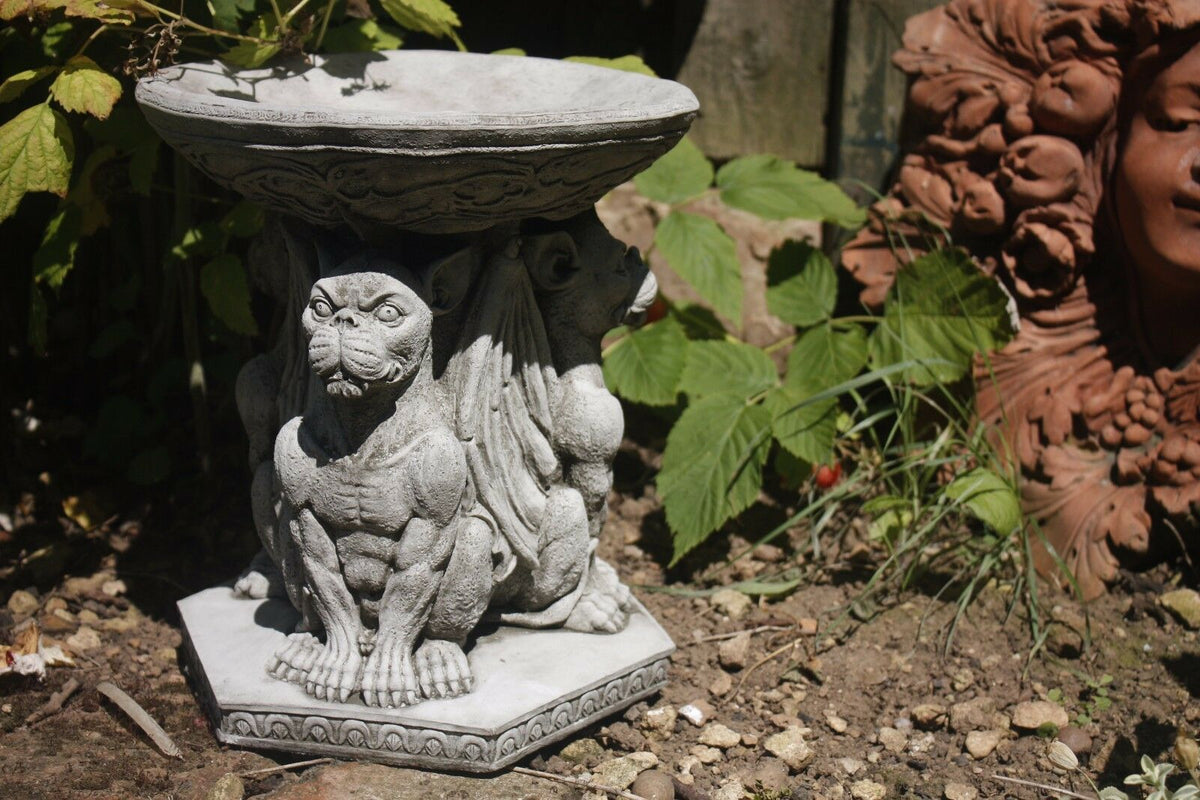 Detailed view of Stone Gargoyle Design Bird Bath featuring muscular winged figures, perfect for gothic garden decoration and bird feeding.