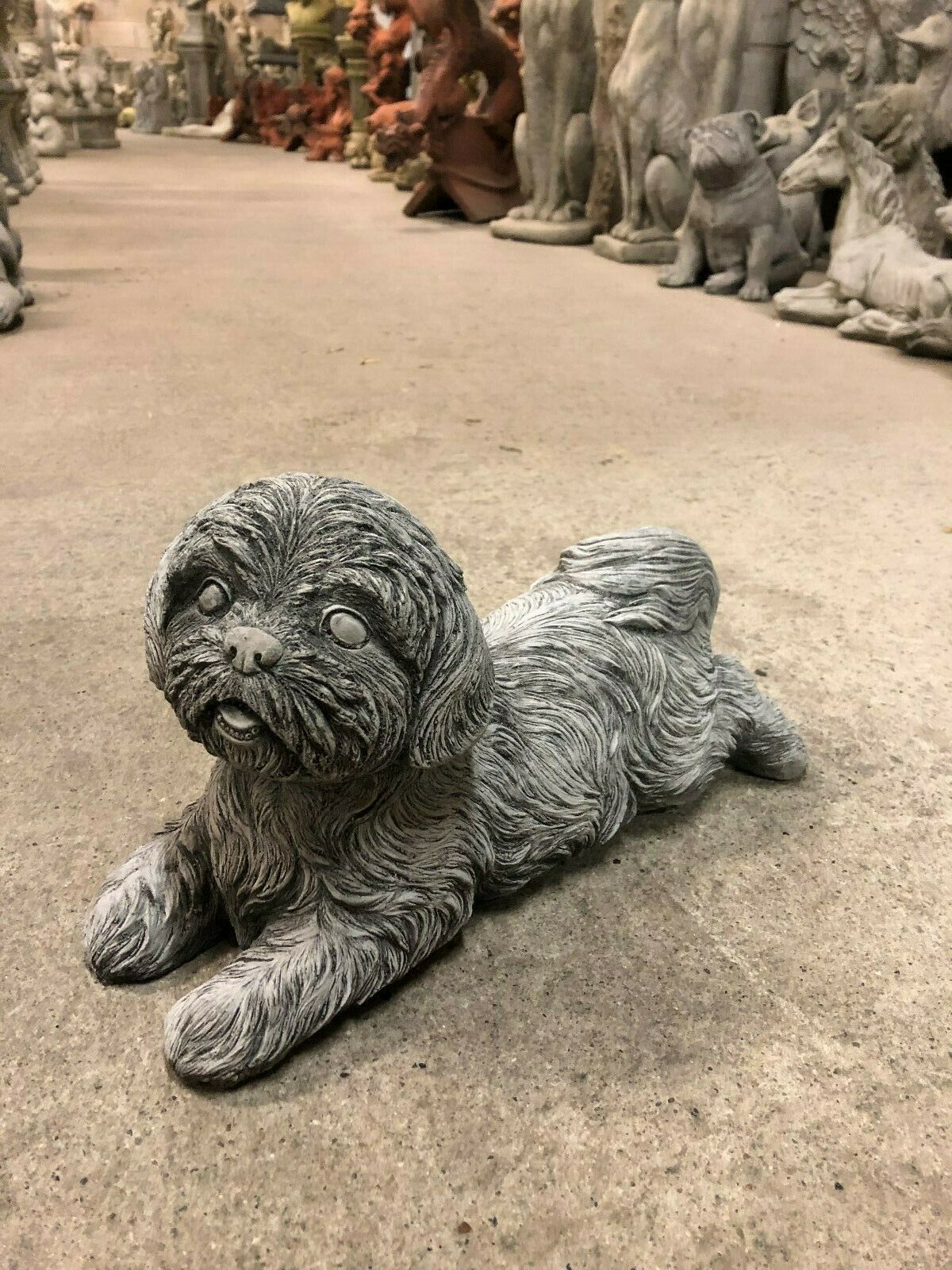 Stone Garden Ornament - Shih Tzu Style sculpture in a laying pose, ideal for outdoor garden decor. Crafted from durable limestone for all-weather use.