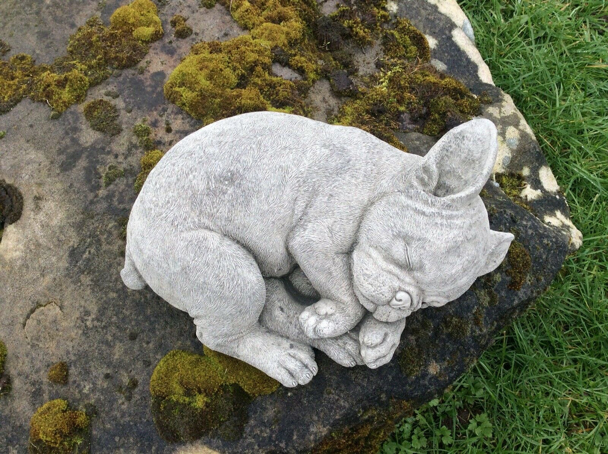 Top view of detailed stone French Bulldog sleeping ornament, showcasing lifelike texture and craftsmanship for garden decoration.