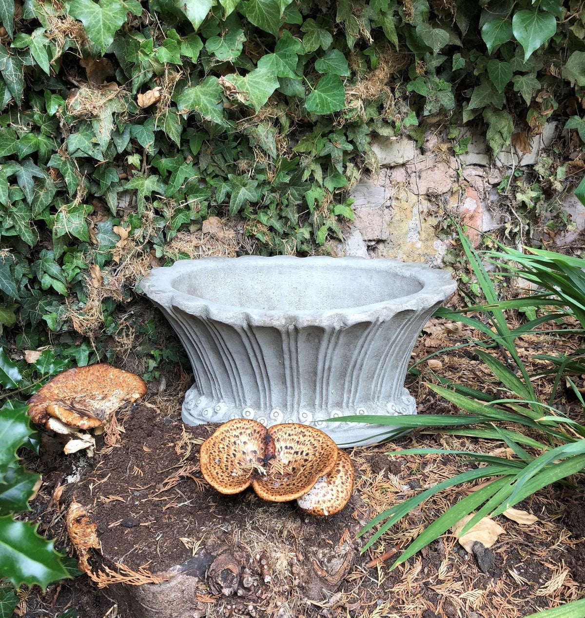 Elegant stone fluted garden pot planter with decorative detailing, ideal for outdoor use in lawns, patios, or flower beds.