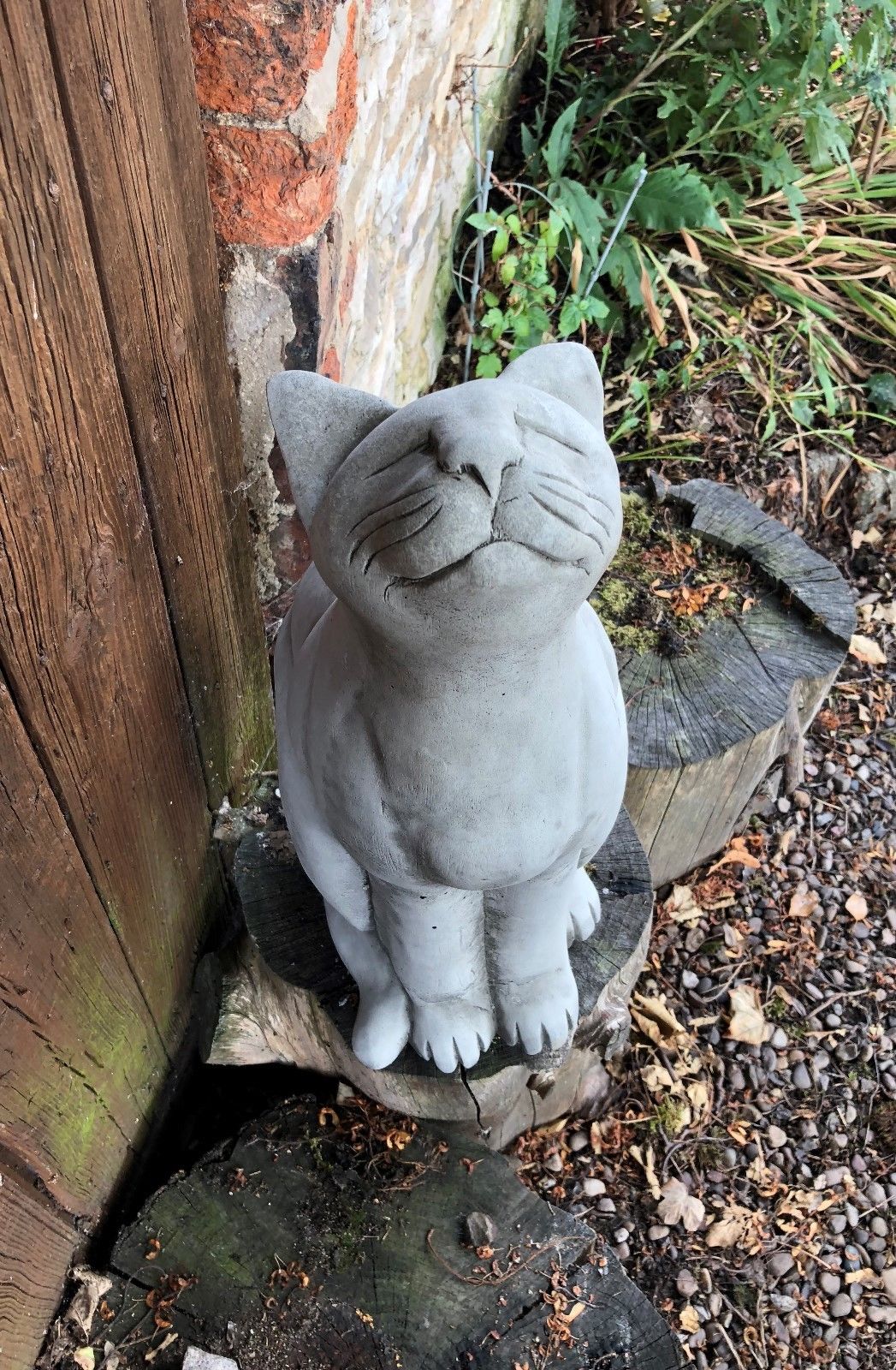 Durable Stone Cat Garden Ornament with antique grey finish, showing front view of cat statue with detailed facial features and paws.