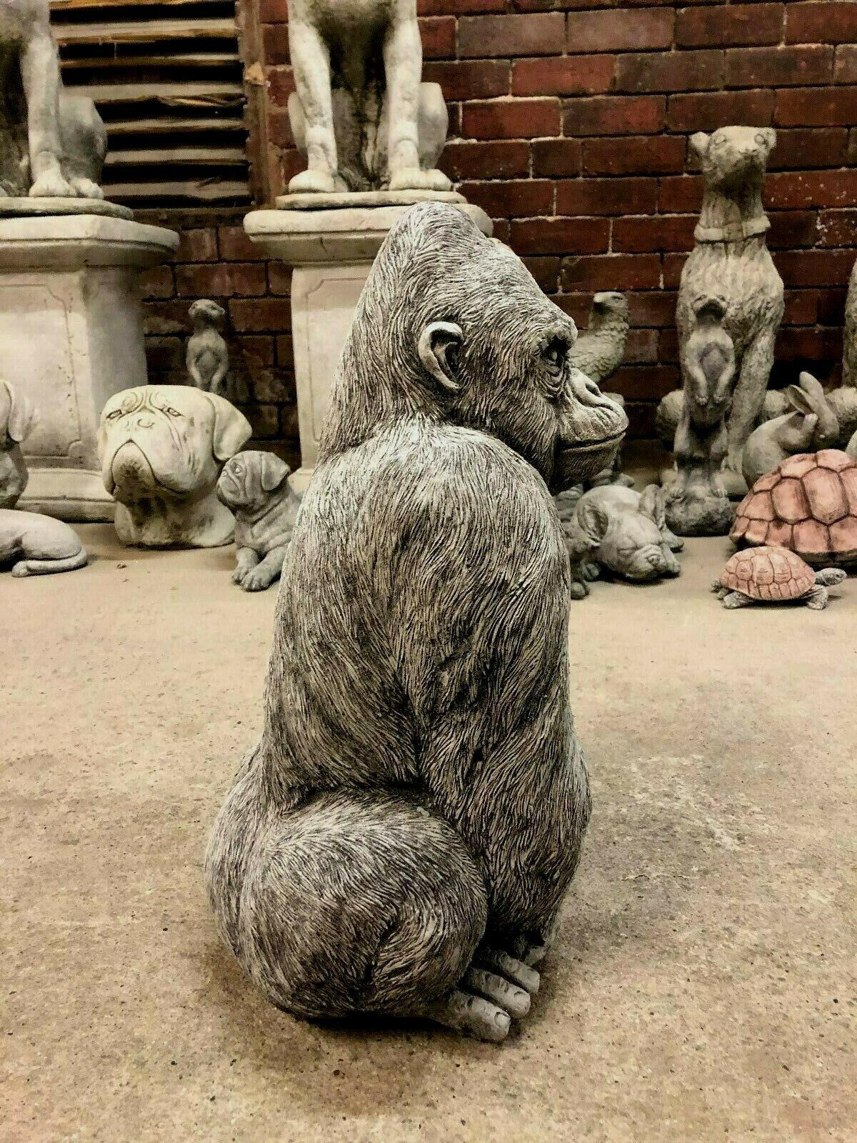 Right profile of weather-resistant Stone Silverback Gorilla Statue, crafted for realistic appearance in garden sculpture displays.