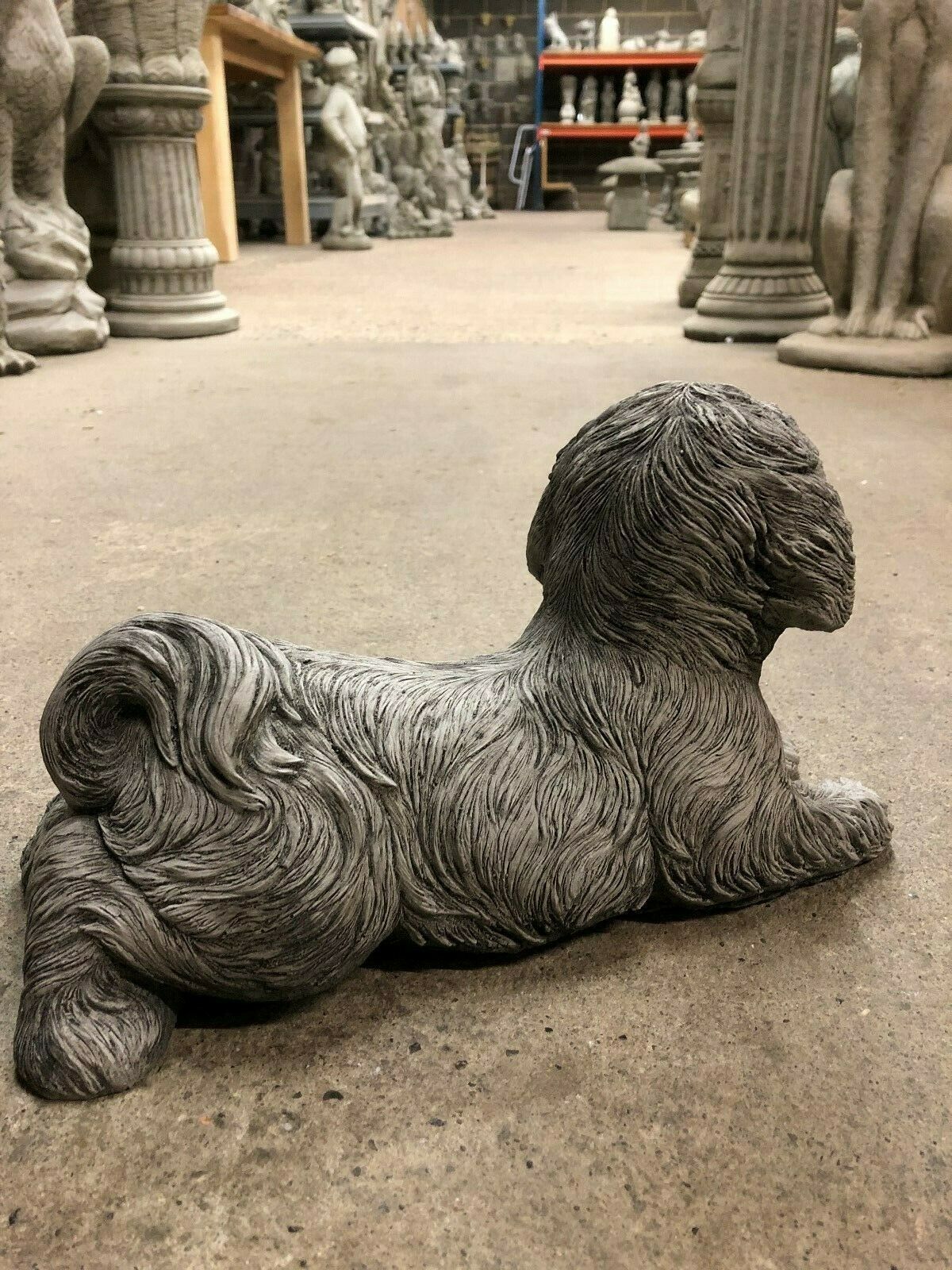Back angle of Shih Tzu Stone Garden Ornament with realistic fur detailing. Made from solid limestone for long-lasting outdoor decoration.