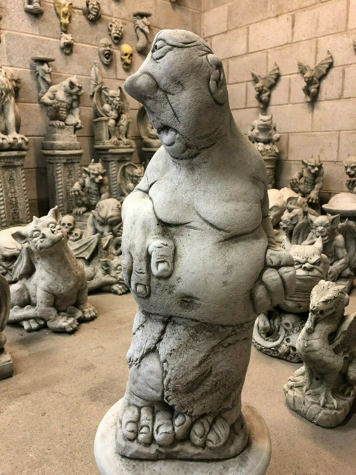 Detailed view of stone boxer statue with expressive face and round belly, part of Bare Knuckle Boxer Statues - Garden Ornaments.