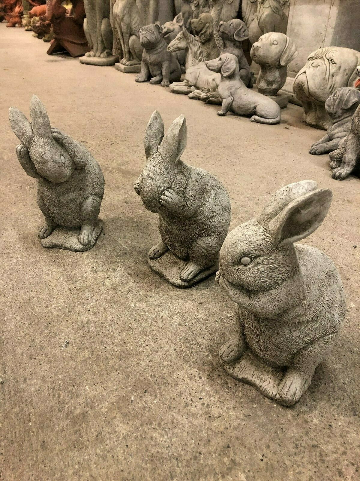 Stone Rabbit Trio garden sculptures in Hear No Evil, See No Evil, Speak No Evil poses, ideal for whimsical outdoor lawn decoration.