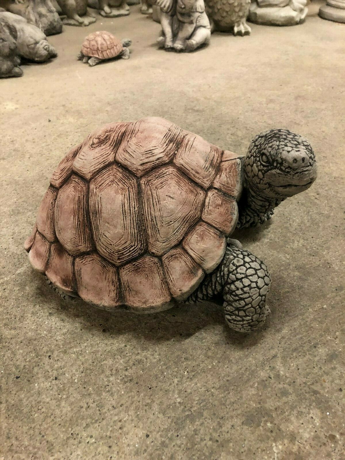 Side view of realistic tortoise garden ornament in stone finish. Great for enhancing garden sculpture collections or outdoor decor.