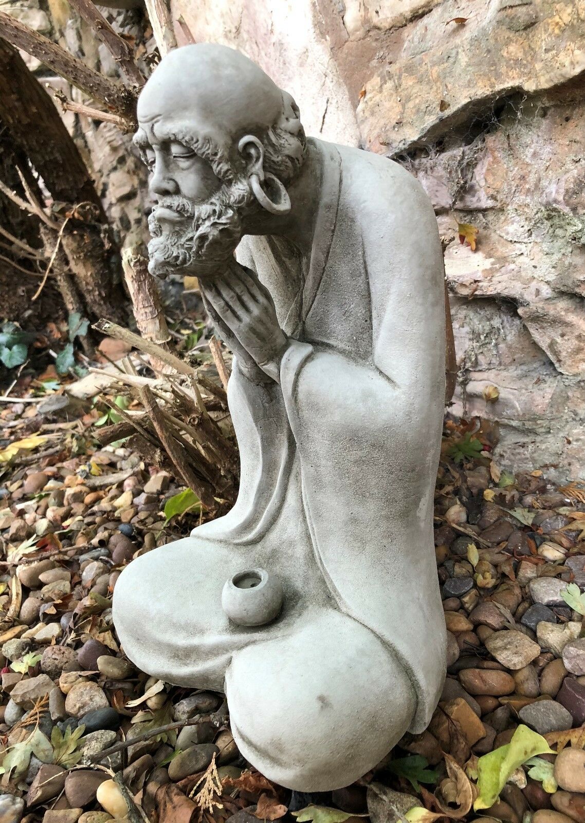 Side view of the Stunning Stone Praying Old Monk Sculpture Garden Ornament, showcasing detailed craftsmanship and antique stone finish.