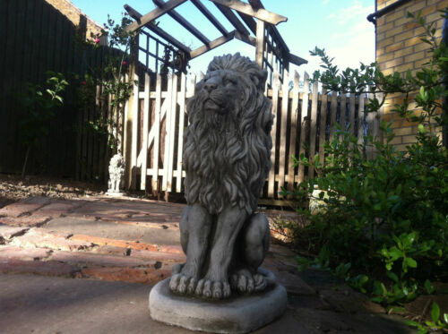 Single stone lion statue placed on a brick walkway, showcasing weather-resistant craftsmanship for garden or patio use.