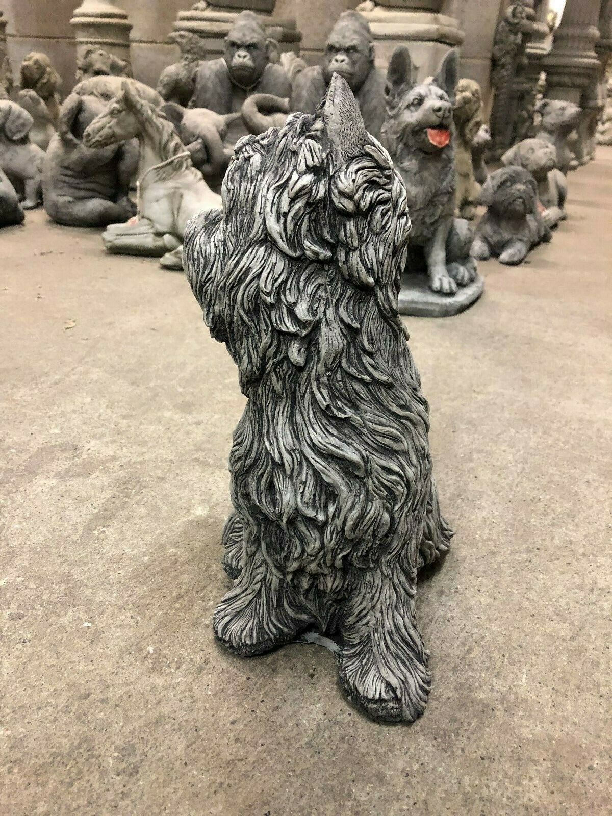 Rear view of Westie Dog Statue - Stone Sculpture showing detailed fur texture. Handmade limestone ornament for home or garden decoration.